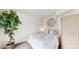 Cozy bedroom with a comfortable bed, accent art, and natural light at 8701 Huron St # 1-207, Thornton, CO 80260