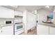 Functional kitchen with ample cabinet space and essential appliances at 8701 Huron St # 1-207, Thornton, CO 80260