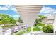 A view from the porch of the manicured lawn, walkway, and street at 8701 Huron St # 1-207, Thornton, CO 80260