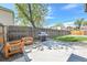 Backyard features a patio with outdoor seating and a grill, surrounded by lush greenery at 1939 S Sherman St, Denver, CO 80210