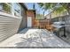 This fenced-in backyard features an outdoor kitchen and a patio with seating, ideal for entertaining at 1939 S Sherman St, Denver, CO 80210