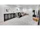 Spacious finished basement boasts recessed lighting, neutral decor, and soft gray carpeting at 1939 S Sherman St, Denver, CO 80210
