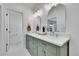 Elegant bathroom featuring a dual vanity with marble countertops and hexagon tile floor at 1939 S Sherman St, Denver, CO 80210