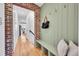 Warm entryway with a coat rack and convenient bench seating offers ample storage at 1939 S Sherman St, Denver, CO 80210