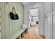 Inviting entryway features a charming bench, coat hooks, and stylish decor at 1939 S Sherman St, Denver, CO 80210