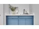 Stylish mudroom features custom blue cabinetry, quartz countertops, and sleek hardware at 1939 S Sherman St, Denver, CO 80210