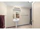 Bright bathroom with a pedestal sink, a well-lit mirror, and a shower with a blue curtain at 6895 E 74Th Ave, Commerce City, CO 80022