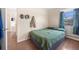 Cozy bedroom with view to hallway and wooden floors at 6895 E 74Th Ave, Commerce City, CO 80022