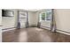 Bedroom with wood floors and ample natural light at 6895 E 74Th Ave, Commerce City, CO 80022