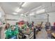 Cluttered garage with tools and storage at 6895 E 74Th Ave, Commerce City, CO 80022