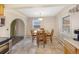 Dining area with tile floors and a view of the kitchen at 6895 E 74Th Ave, Commerce City, CO 80022