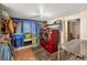 Functional laundry room featuring updated red washer and dryer and ample storage space at 6895 E 74Th Ave, Commerce City, CO 80022