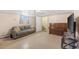 This living room features a comfortable gray sofa and an antique piano at 6895 E 74Th Ave, Commerce City, CO 80022