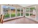 Bright sunroom with large windows overlooking the backyard at 6895 E 74Th Ave, Commerce City, CO 80022