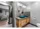 Modern bathroom featuring vessel sinks and a view into the living area at 1390 Emporia St, Aurora, CO 80010