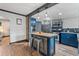 Kitchen and island with stainless steel appliances, and butcher block top at 1390 Emporia St, Aurora, CO 80010
