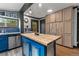 Kitchen island features butcher block top, blue base and stainless steel accents at 1390 Emporia St, Aurora, CO 80010