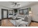 Cozy living room featuring a large sectional sofa, hardwood floors, and an inviting atmosphere at 1390 Emporia St, Aurora, CO 80010