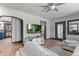 Bright and airy living room featuring hardwood floors, modern decor, and open layout to other rooms at 1390 Emporia St, Aurora, CO 80010