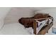 Loft area features a bed with a brown comforter and wood accents at 1390 Emporia St, Aurora, CO 80010