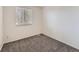 Small bedroom with neutral walls and carpet at 4209 S Halifax Ct, Aurora, CO 80013