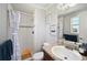 Updated bathroom with shower, mosaic tile accents, new fixtures, and a modern single sink vanity at 12931 E 46Th Ave, Denver, CO 80239