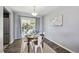 Cozy dining room featuring stylish furnishings, modern decor, and a sliding door that leads to an outdoor patio at 12931 E 46Th Ave, Denver, CO 80239