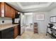 Functional kitchen featuring wood cabinets, stainless steel appliances, and convenient layout for cooking and meal preparation at 12931 E 46Th Ave, Denver, CO 80239