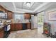 Well-appointed kitchen with wood cabinetry, stainless steel appliances, and access to the backyard, perfect for entertaining at 12931 E 46Th Ave, Denver, CO 80239