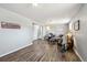 Bright living room with lots of natural light, luxury vinyl plank floors, and comfortable furnishings at 12931 E 46Th Ave, Denver, CO 80239