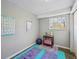 Spare room with window, exercise mats, posters, and yoga ball, which is perfect for a home gym at 12931 E 46Th Ave, Denver, CO 80239