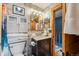 Stylish bathroom with marble countertop, wood accents, and modern fixtures at 876 Broken Lance Dr, Breckenridge, CO 80424