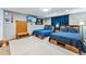 The carpeted bedroom includes two beds, a TV, and comfortable furnishings at 876 Broken Lance Dr, Breckenridge, CO 80424