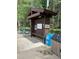 A bus stop near a wooded area offers convenient transportation options for residents and visitors alike at 876 Broken Lance Dr, Breckenridge, CO 80424