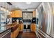 Updated kitchen with stainless steel appliances, wooden cabinets, and a copper sink at 876 Broken Lance Dr, Breckenridge, CO 80424