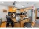 Modern kitchen featuring black countertop and bar seating at 876 Broken Lance Dr, Breckenridge, CO 80424