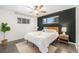 Stylish bedroom with modern decor, a cozy bed, and natural light at 7625 Turner Dr, Denver, CO 80221