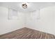 Clean bedroom with two windows and vinyl floors at 7625 Turner Dr, Denver, CO 80221