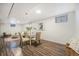 Bright dining area with a glass-top table and comfortable seating, perfect for Gathering meals and gatherings at 7625 Turner Dr, Denver, CO 80221