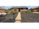 Charming brick home with updated landscaping and a walkway leading to the front door at 7625 Turner Dr, Denver, CO 80221