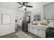 Modern kitchen with stainless steel appliances, grey cabinets, and a spacious layout at 7625 Turner Dr, Denver, CO 80221