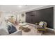 Inviting living room featuring a comfortable sofa and accent chair, ideal for relaxing and socializing at 7625 Turner Dr, Denver, CO 80221