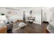Inviting living room featuring hardwood floors and stylish contemporary furnishings at 7625 Turner Dr, Denver, CO 80221