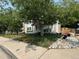 House with mature trees and rock landscaping in front at 4316 N Malta St, Denver, CO 80249