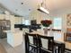 Eat-in kitchen featuring granite island and updated cabinetry at 4316 N Malta St, Denver, CO 80249