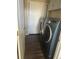 Laundry room with washer, dryer, and built-in cabinets at 4316 N Malta St, Denver, CO 80249