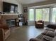 Living room with fireplace, large windows and hardwood floors at 4316 N Malta St, Denver, CO 80249