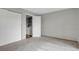 Cozy bedroom with neutral carpet, large closet, and convenient laundry area at 195 S Sable Blvd # U12, Aurora, CO 80012