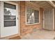 Close up of the entrance, featuring a front door and a large window at 195 S Sable Blvd # U12, Aurora, CO 80012