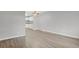 Spacious living room with sleek laminate floors, neutral paint, and modern ceiling fan at 195 S Sable Blvd # U12, Aurora, CO 80012